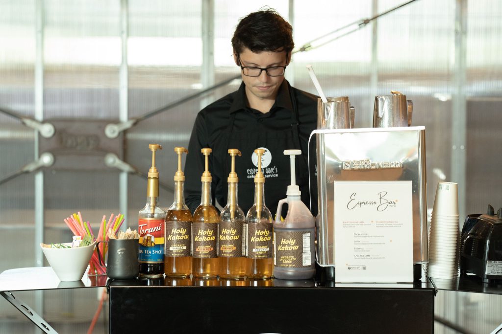 Espresso Dave Barista in black uniform behind his espresso cart while at alcohol free events.