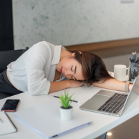 woman power napping at desk