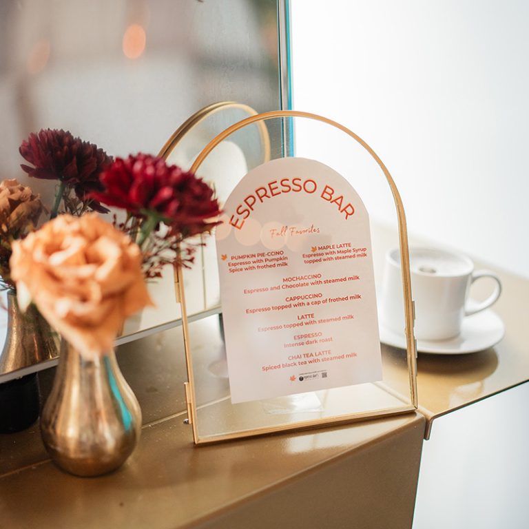 Framed fall menu on Espresso Dave Coffee Catering gold mobile espresso bar with small vase of flowers and cappuccino cup Capture the North photography