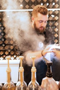 Barista steaming milk at mobile espresso cart Boston for coffee catering event tucker finerty photograph